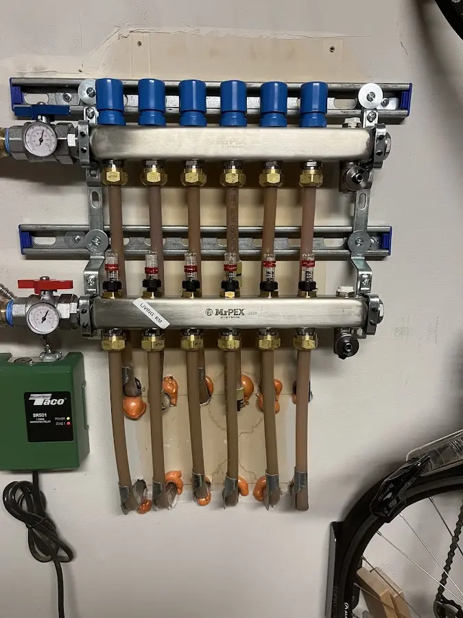 Plumber performing Water Heater Repair at a residential property in New Carrollton